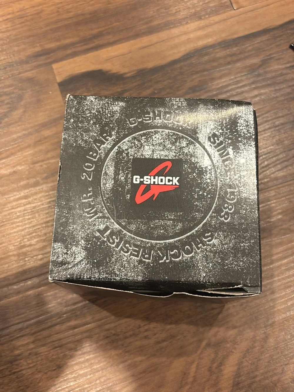 Casio G-Shock Blue Watch with White Bezel and Red Accents